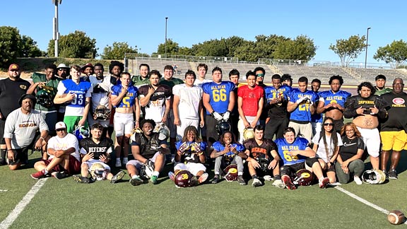 Players and coaches for the North team pose together after practice for the 47th edition of the Lions All-Star Football Game.