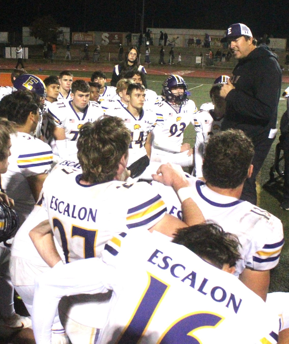 Escalon head football coach Andrew Beam addresses his varsity team after a 2025 playoff game
